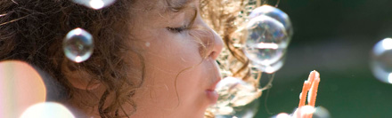 Child blowing bubbles